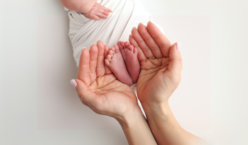 new mom with her baby in image