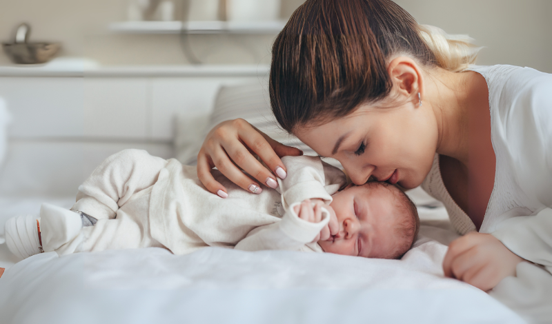 new mom with her baby in image