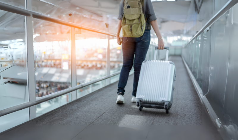 a man carry a Suitcase in image